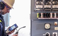 A man checking on the condition of substation assets